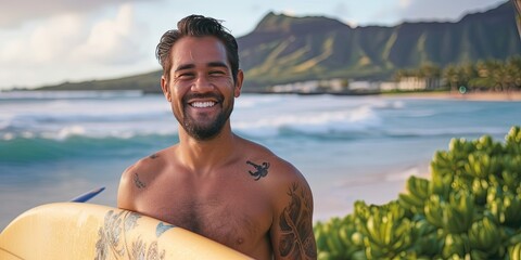 Smiling man holding surfboard on the tropical beach