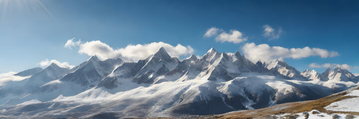 Fototapeta na wymiar Snow-capped peaks illuminated by sunlight, presenting a magnificent natural landscape. 3:1 landscape banner and background style. Space for text. Suitable for website headers or background images.