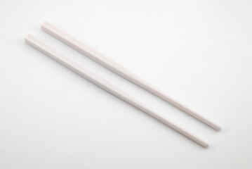 white plastic chopsticks for sushi and Asian cuisine