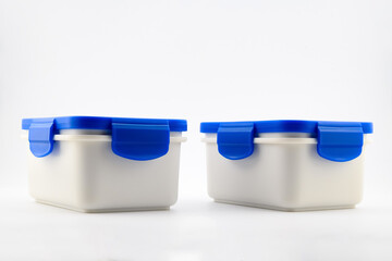 two white food plastic containers with blue lid for lunch