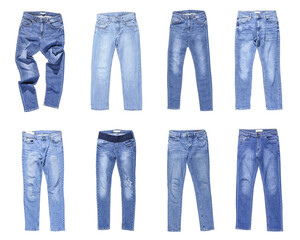 Set of different stylish jeans pants isolated on white