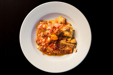 One portion of lasagna in a bowl