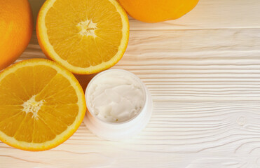 Cream with citrus extracts. Selective focus. Spa day, concept of freshness cream can with lemon lime and orange extract