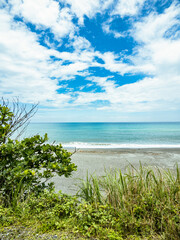 The Seashore and the Blue Sky with White Clouds