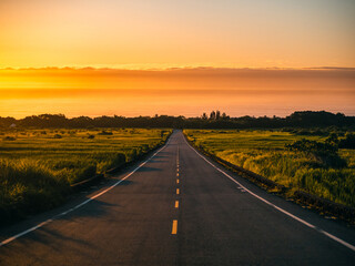 Watching the Sunrise over the Sea from the Road