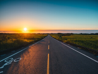 Watching the Sunrise over the Sea from the Road