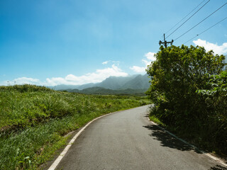 Road and Mountain Scenery in sunny day	