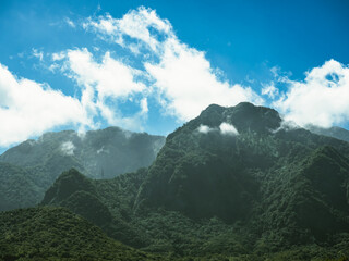 Layered mountain view of sunny day