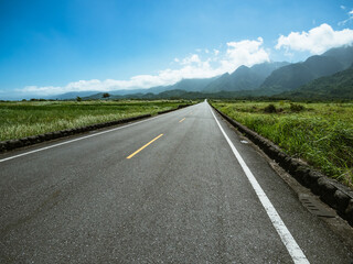 Road and Mountain Scenery in sunny day	