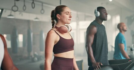 People, fitness and walking on treadmill for cardio, workout or warm up together at gym. Group of young athletes in stroll on stationary equipment at health club for exercise, training or weight loss - Powered by Adobe