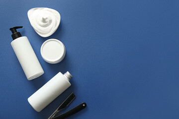 Set of shaving accessories on blue background
