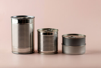 Various Size Canned Food on Pink Background