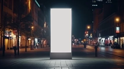 Fotobehang Blank vertical billboard outdoors, outdoor advertising lightbox, public information board, digital screen stand in city at night, on lighted street. © Muhammad