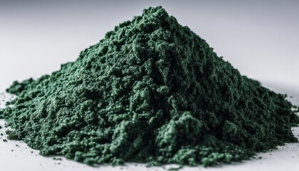 Fototapeta premium A pile of green powder on a white background