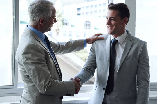 Handshake, business people and agreement in promotion, congratulations and thank you for recruitment. Manager, employee and introduction or networking in office, collaboration and support in meeting