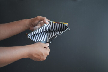 Man hand open an empty wallet with copy space.