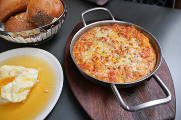 Turkish Menemen omelet in a frying pan. .