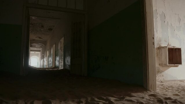 Long dark corridor in an abandoned building.