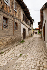 Fototapeta na wymiar Traditional ottoman house in Safranbolu.historical stone stairs and old ottoman mansion. Safranbolu UNESCO World Heritage Site. Old wooden mansion. Ottoman architecture