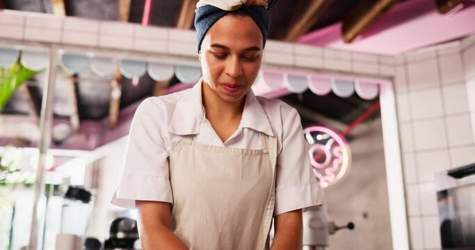 Cooking, dough and store with woman in bakery for food, small business or bread production. Chef, restaurant and nutrition with baker and flour in kitchen for dessert, culinary and pastry preparation