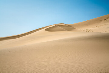 Fototapeta na wymiar Dunes in profile blue and tan