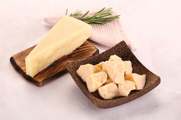 Chopped Italian hard parmesan cheese