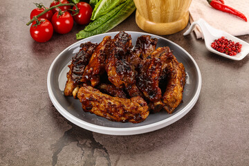 Grilled pork ribs in barbecue sauce