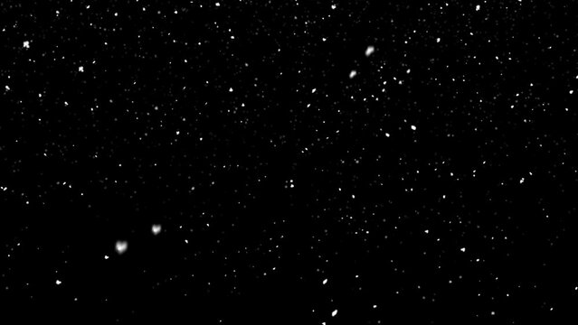 falling snow flakes on a black background 