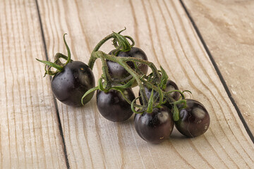 Ripe tasty black cherry tomato