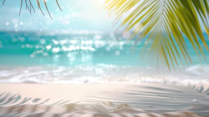 Fototapeta na wymiar Close-up of sandy beach with palm tree shadows and sea
