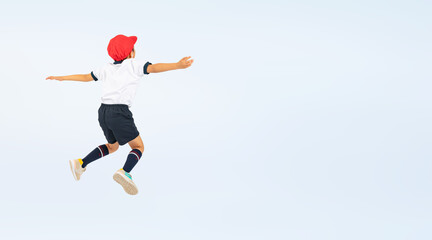 Fototapeta na wymiar ジャンプする体操服を着た男の子（切り抜き背景透過PNGも販売しております。作成者リンクから「PNG」で検索してください）