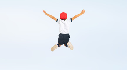 Fototapeta na wymiar ジャンプする体操服を着た男の子の後ろ姿（切り抜き背景透過PNGも販売しております。作成者リンクから「PNG」で検索してください）
