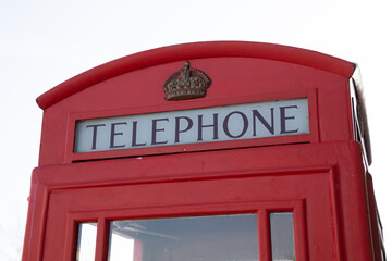 london phone British red telephone box sign text and brand logo