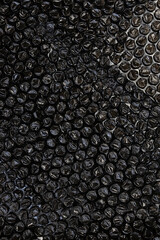 Texture, black bubble plastic wrap surface. plastic with air balls on the surface used to pack. Detail of plastic material.