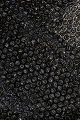 Texture, black bubble plastic wrap surface. plastic with air balls on the surface used to pack. Detail of plastic material.