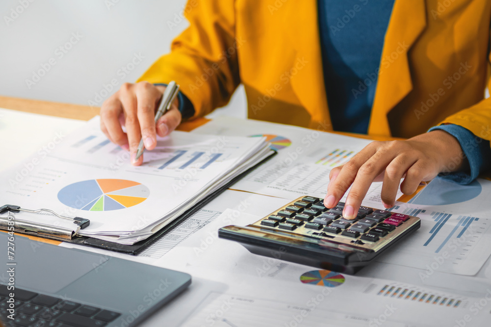 Aufkleber female accountant using calculator and computer with pen in office. concept finance and accounting