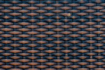 Background with dark brown braided thread texture with copy space.Empty blank backdrop