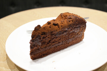 Fototapeta na wymiar A Dark chocolate cake at white plate