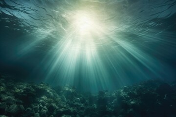 A vibrant image capturing the suns rays as they penetrate the crystal-clear water of the ocean.