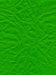 Texture of colored paper, sheet of crumpled dark green paper