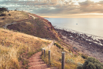Marion to Hallett Cove Coastal Walking Trail downhill and uphill with sea view at sunset, South...