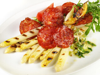 Grilled white Asparagus with Butter and roasted Salami Slices