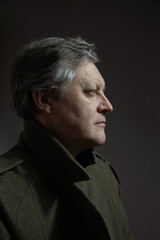 Fototapeta premium close up portrait mature man in military overcoat