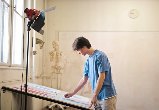 Young Man Draws Skeleton School