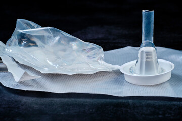 Urological male condom catheter made of transparent silicone removed from sterile packaging