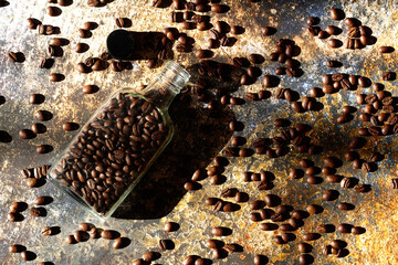 Top view of coffee beans in glass bottle on table
