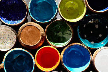 Closeup top view of group empty colorful ceramic cups