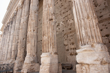 Fototapeta premium Ancient weathered stone pillars of Hadrian's Temple colonnade