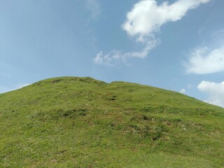 green hill and blue sky