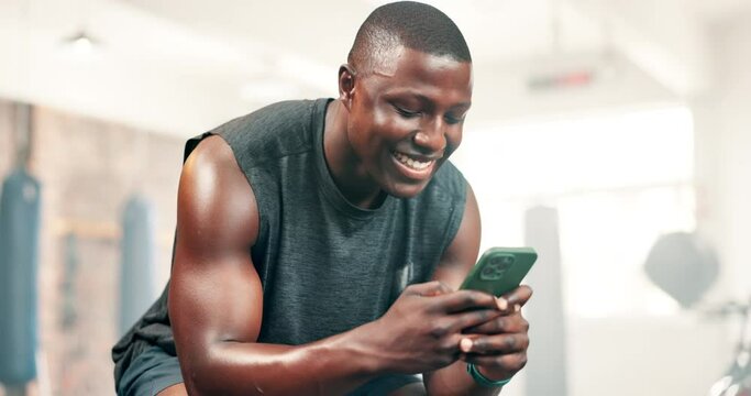 Man, phone and happy for texting in gym, reading or check notification for contact on mobile app. African person, smartphone and fitness with scroll for web blog on internet, social media and chat
